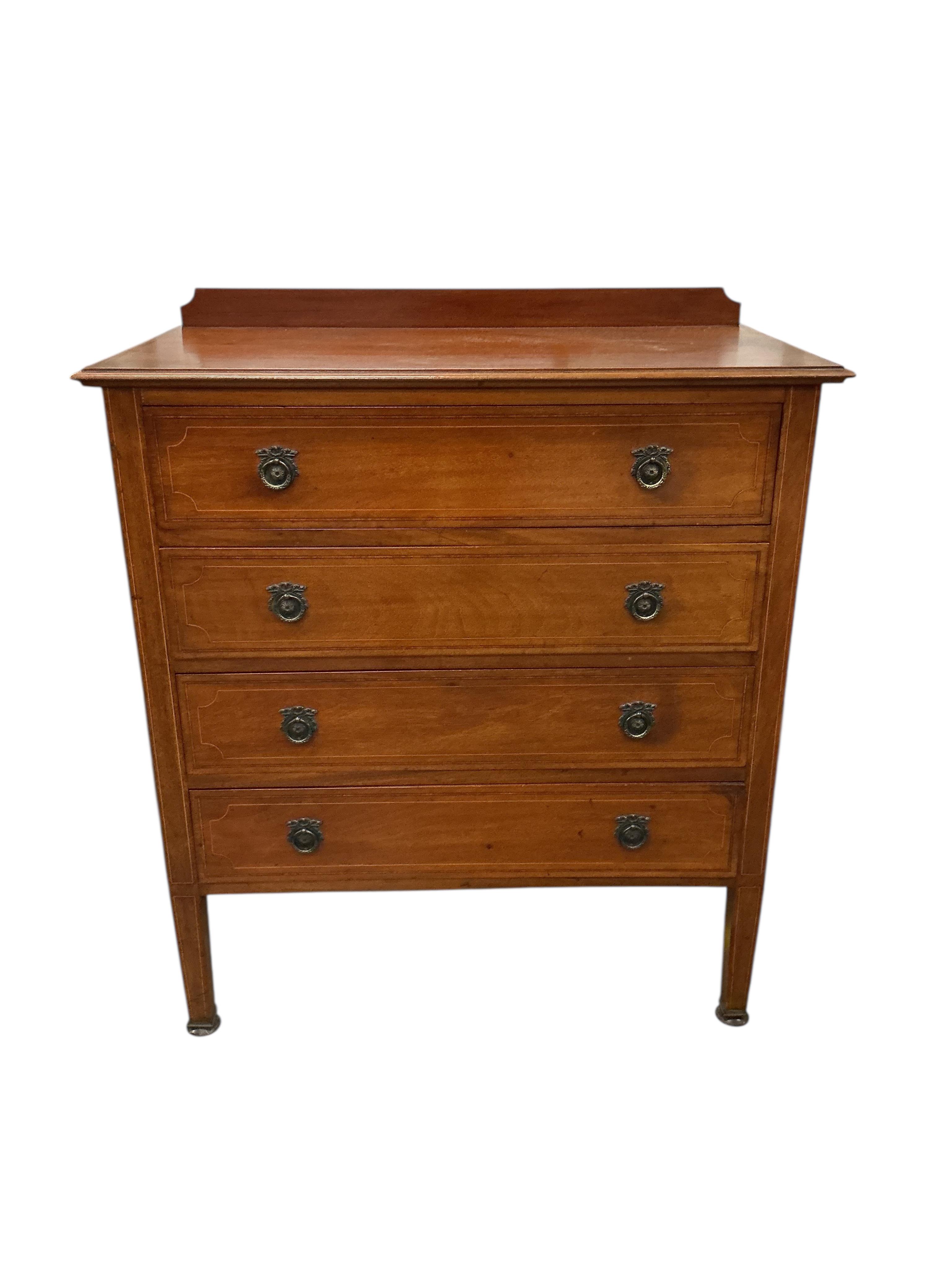 An Edwardian inlaid mahogany dressing table and matching chest of four drawers, larger width 124cm, depth 56cm, height 175cm